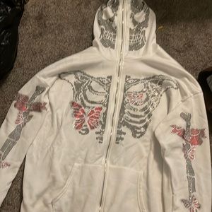 never been worn off white zip up jacket with diamonds skeleton face